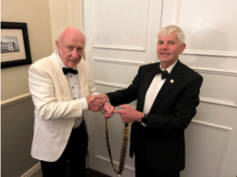 Outgoing President John Morton (left) handing over Rotary chain of office to incoming President Ian Hepworth (right) at The King’s Head, Richmond.